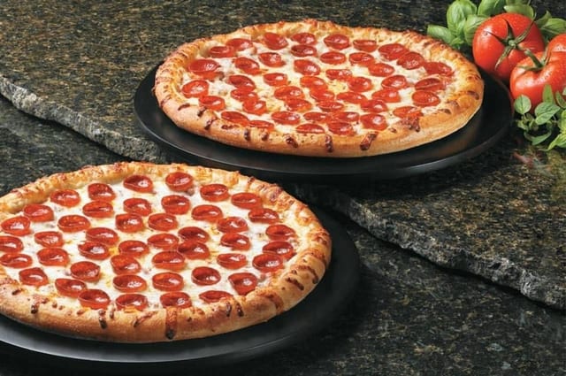 Two Large 14" One Topping Pizza & Half Gallon Tea Special.